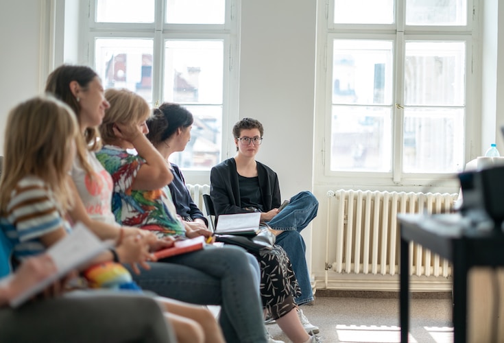 a group of people sitting in a room